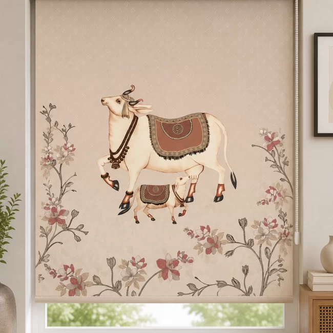 Traditional beige PVC roller blind featuring an Indian folk art cow and calf design with floral accents installed on a modern window